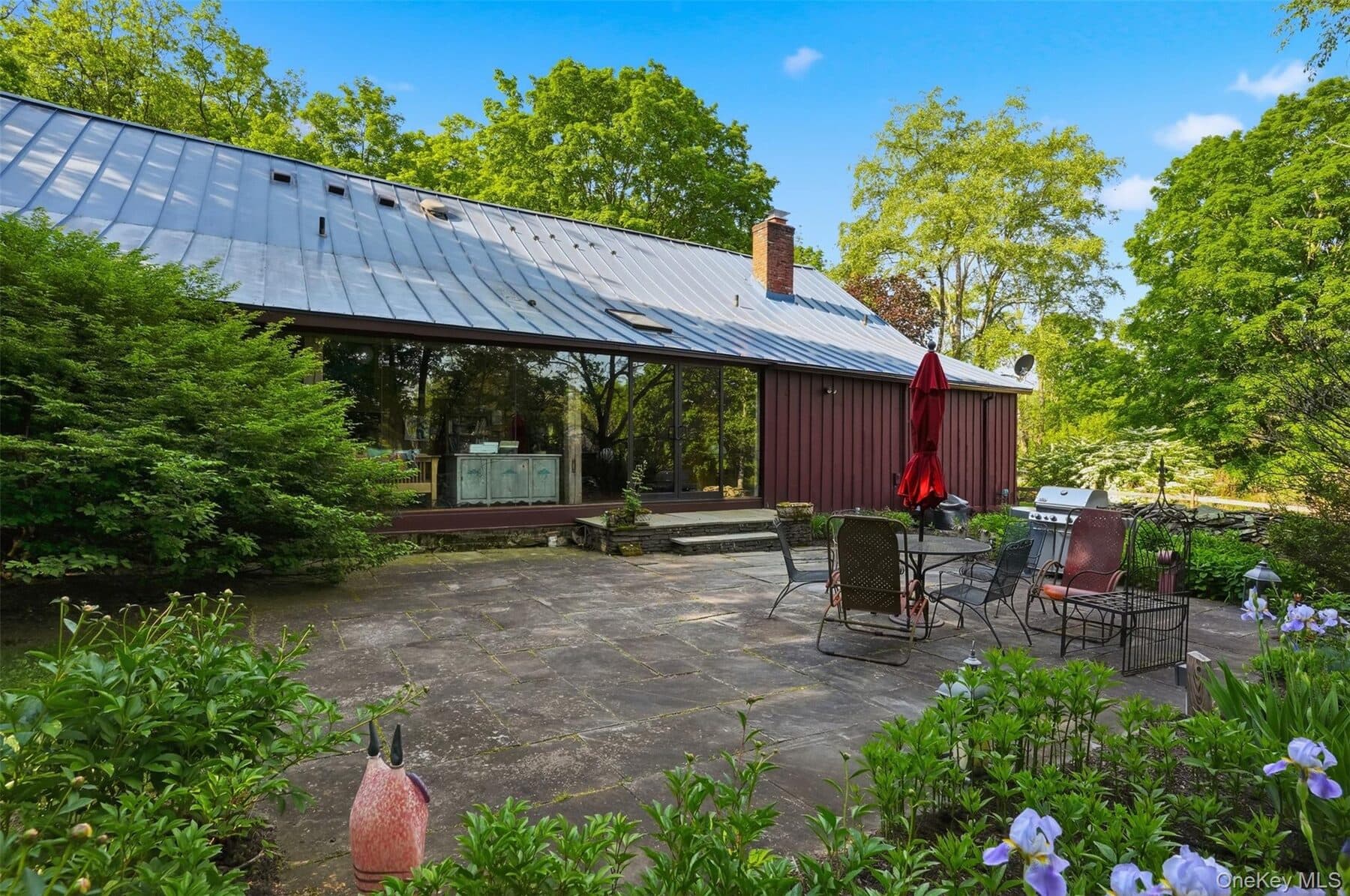 The restored barn exterior with gardens