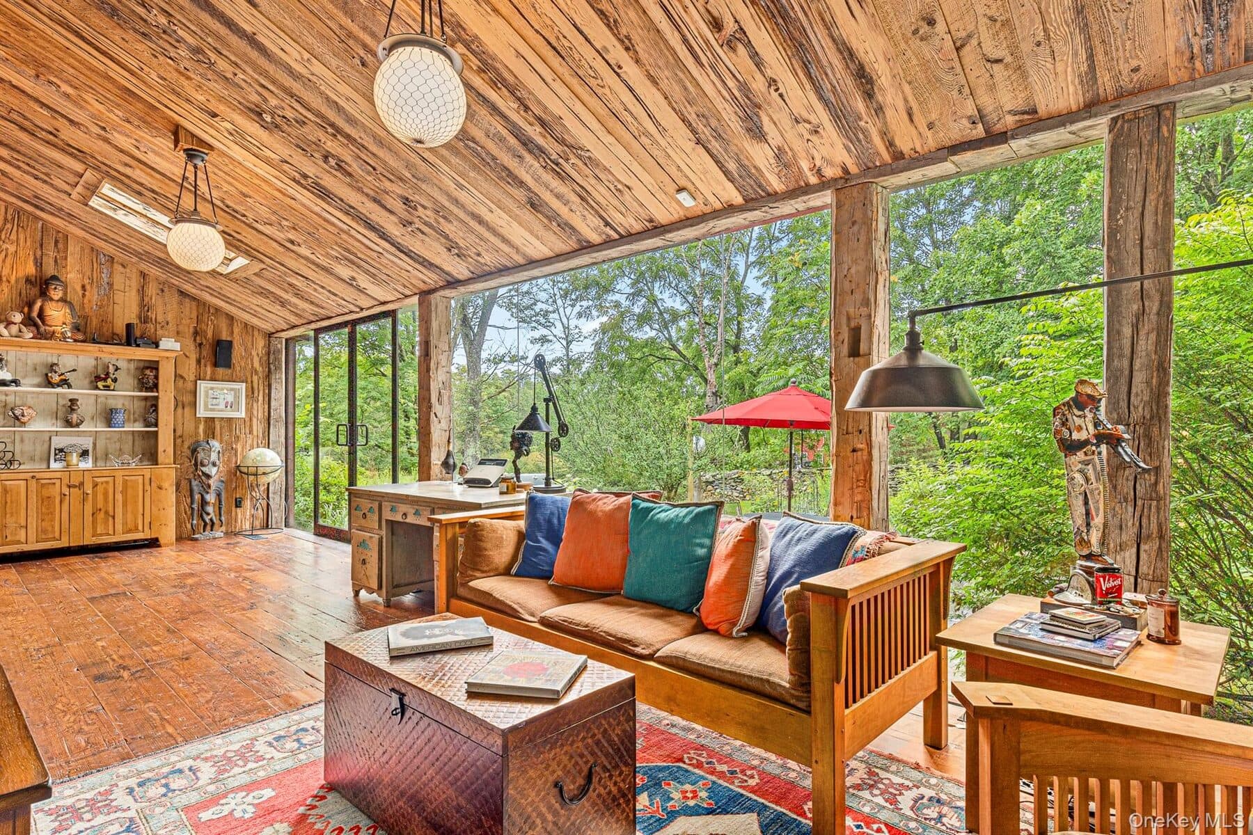 The glass-walled great room with post-and-beam ceilings