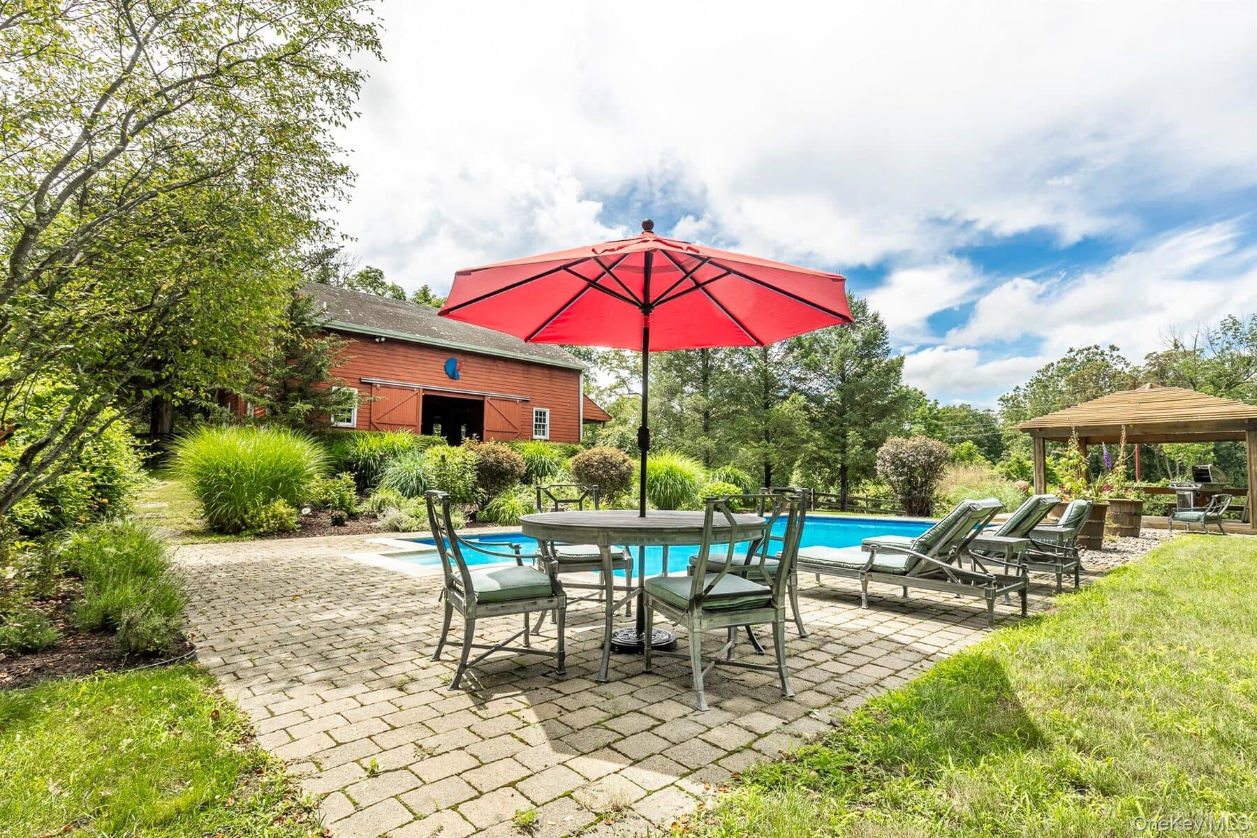 The 20 by 40 foot heated pool surrounded by English garden